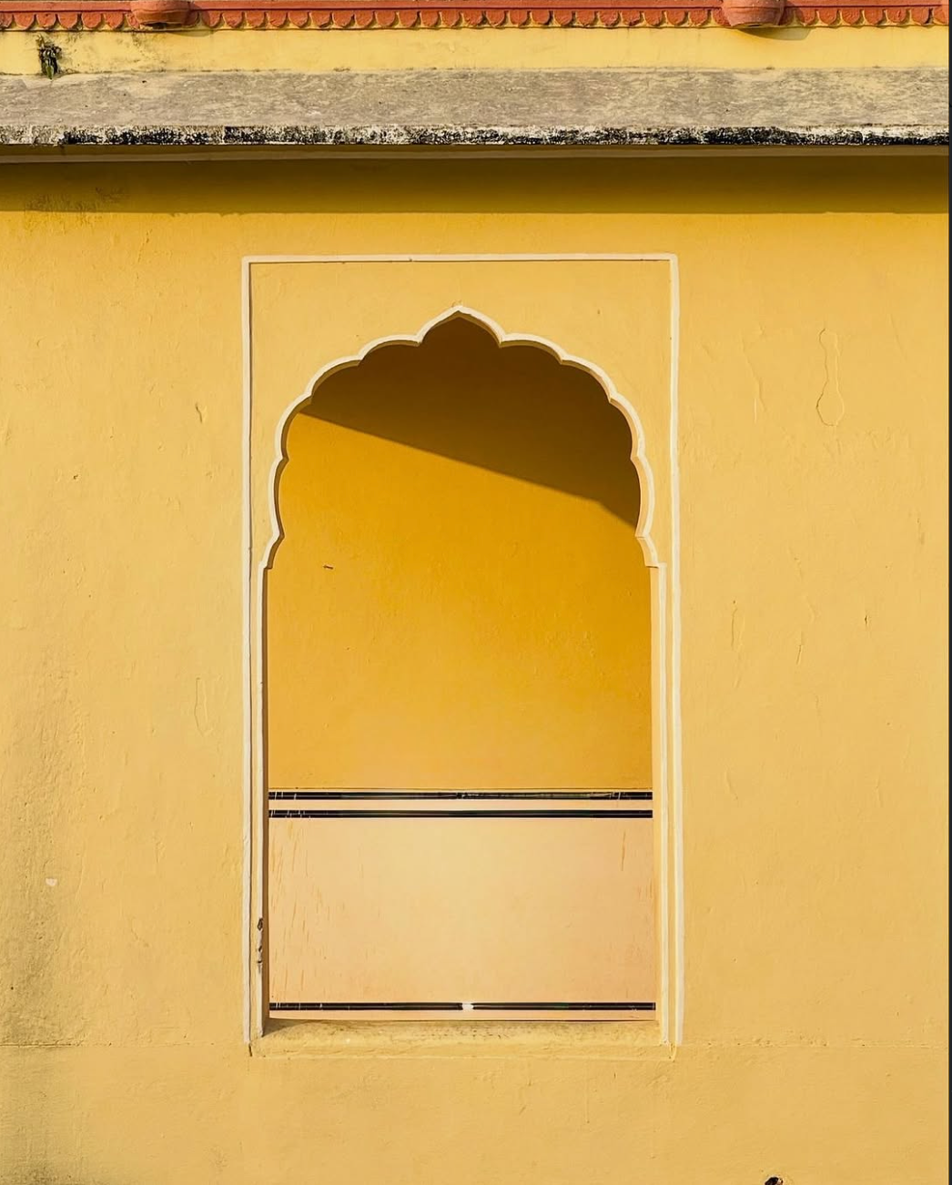 Vamika Silver Instagram post: a yellow arched window in Jaipur