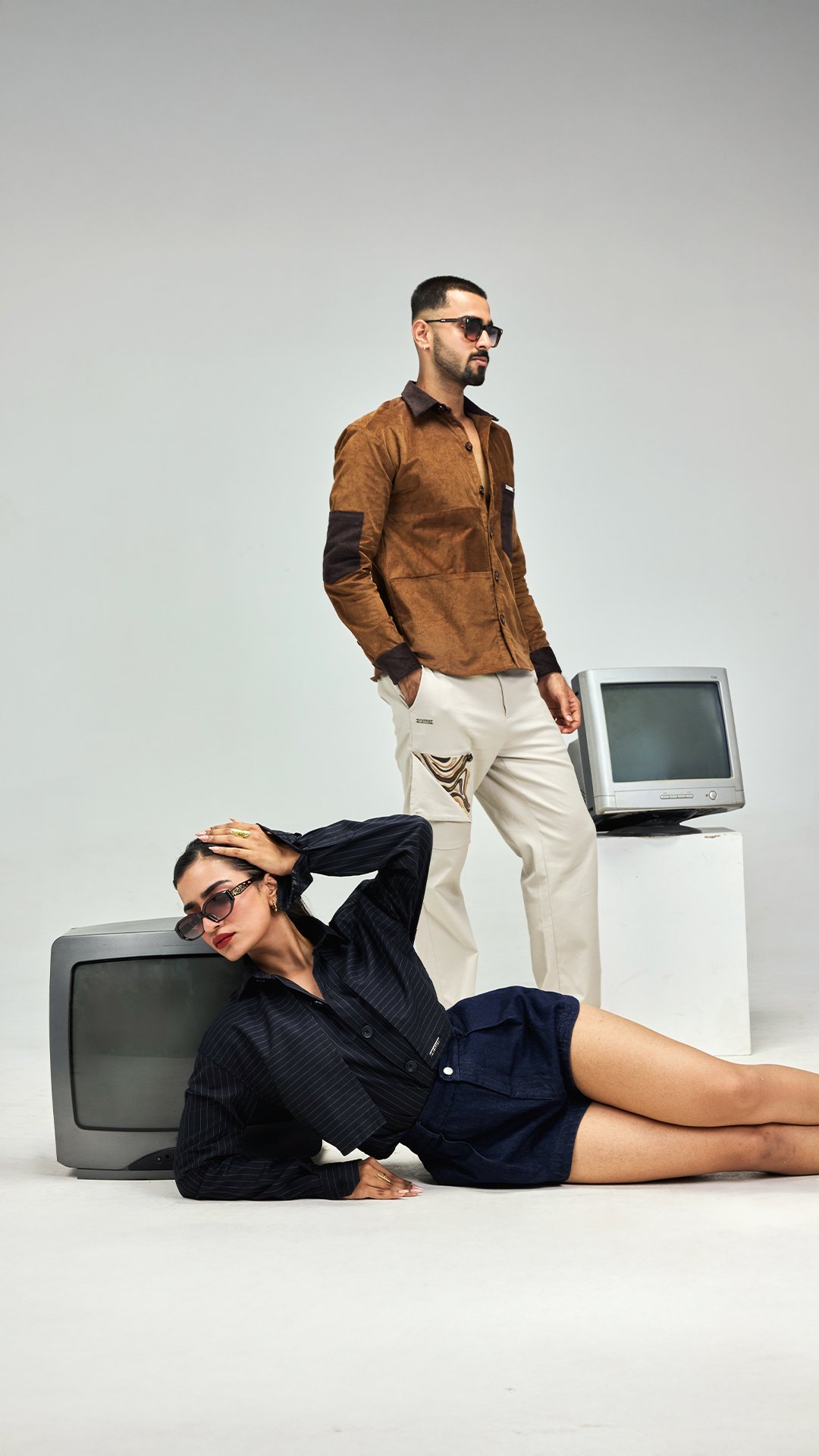 KRWA campaign shoot with two models and vintage television sets
