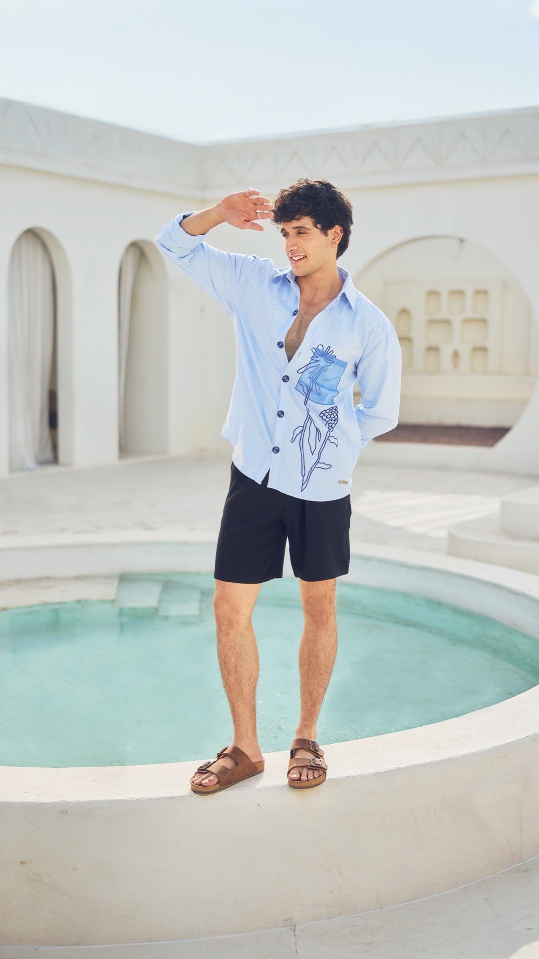 KRWA poolside shoot: model in a printed blue shirt